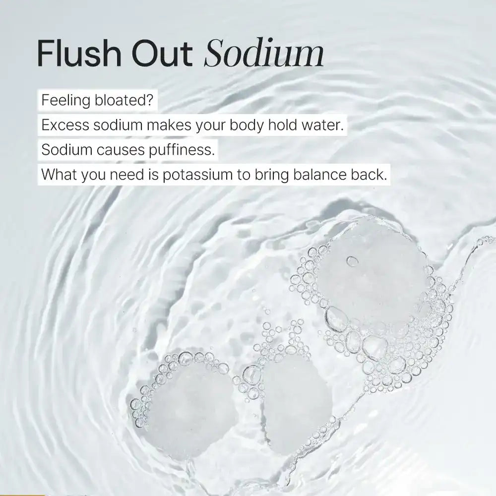 Effervescent supplement dissolving in clear water with Flush Out Sodium text and health tips.