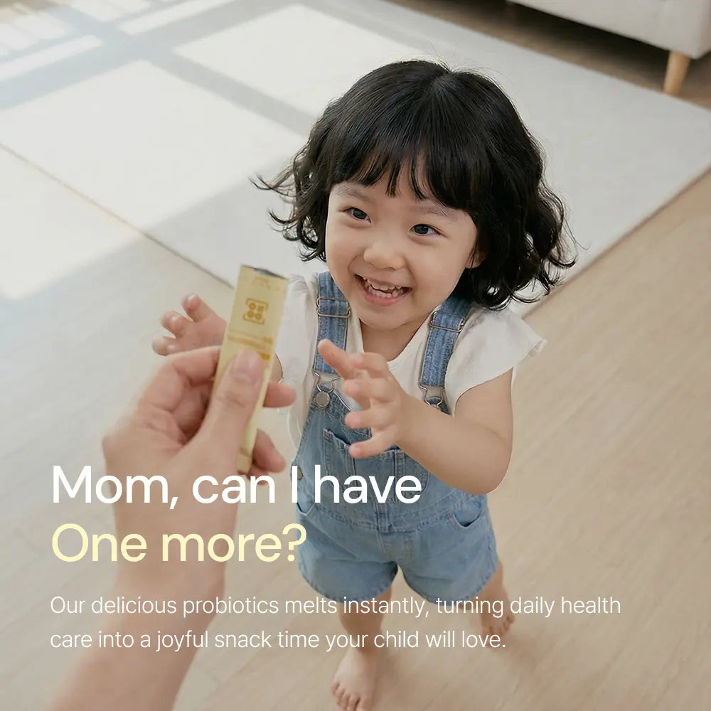 Smiling child in overalls reaching for probiotic supplement stick in a bright home setting