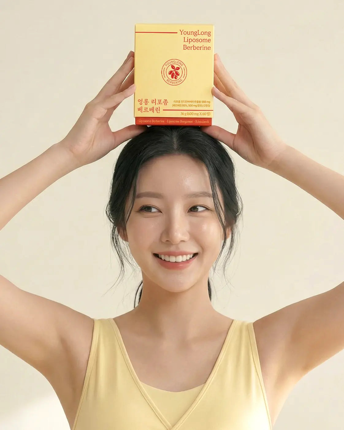 Woman holding YoungLong Liposome Berberine box, promoting vitality and immunity support