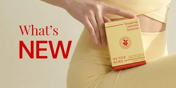 Hand holding YoungLong Liposome Berberine box near waist, highlighting new supplement for vitality and immunity